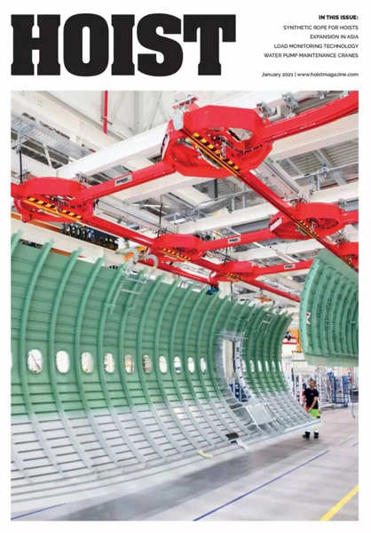 HOIST杂志封面，展示红色起重机和飞机部件